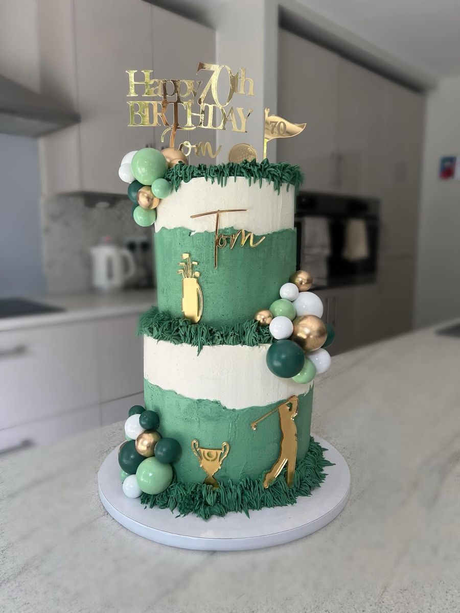 Golf two tier cake by Just In Cakes Co. A two tier 70th with a golf theme, name and gold detail.