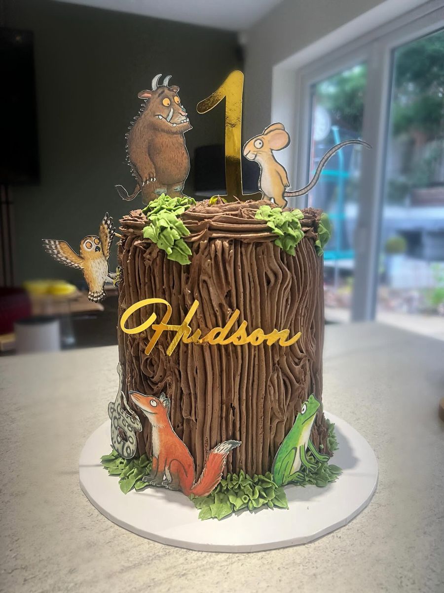 Woodland first birthday cake by Just In Cakes Co. Hand piped tree bark with woodland characters.