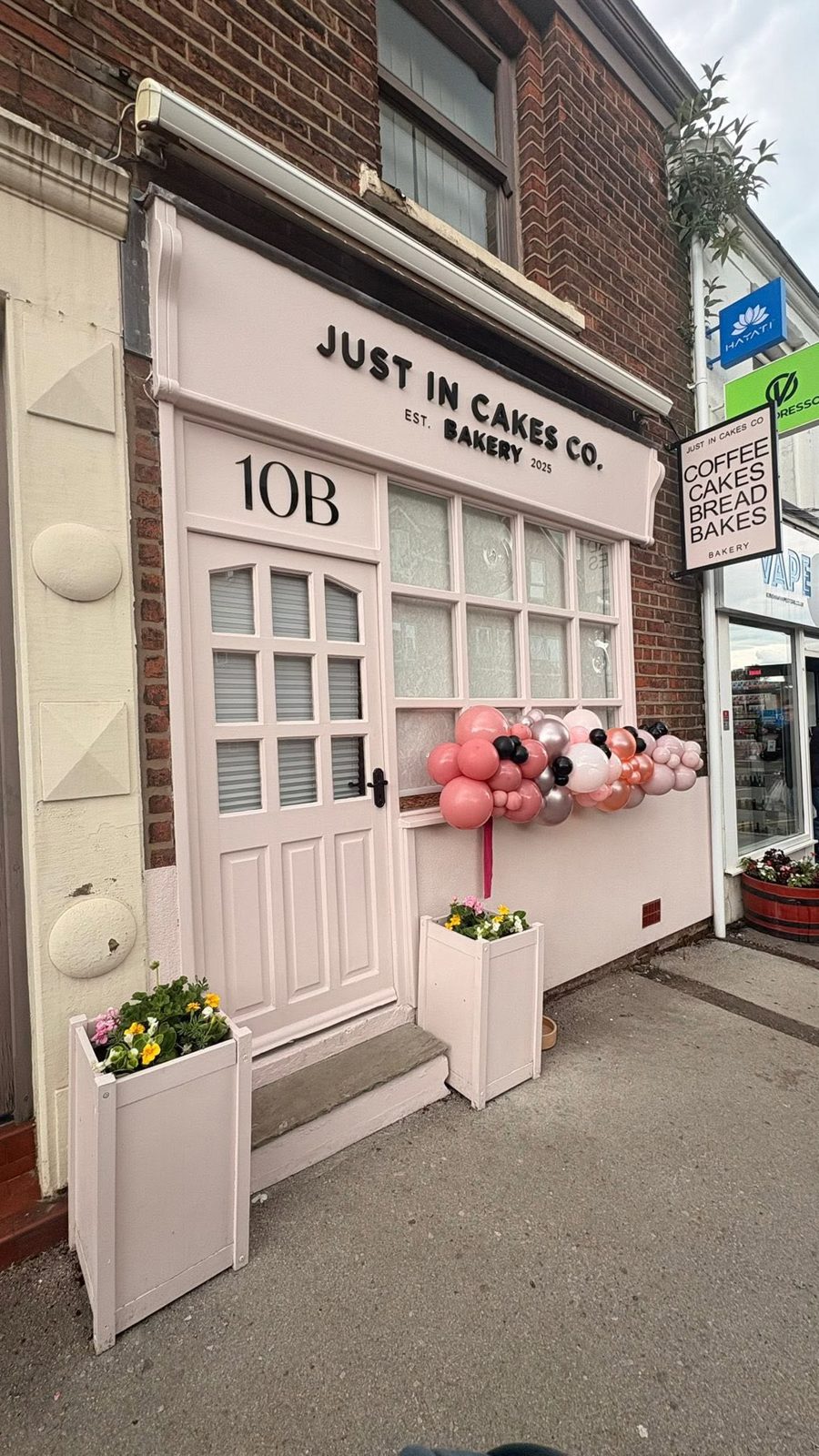 The bakery shop front with pink balloons