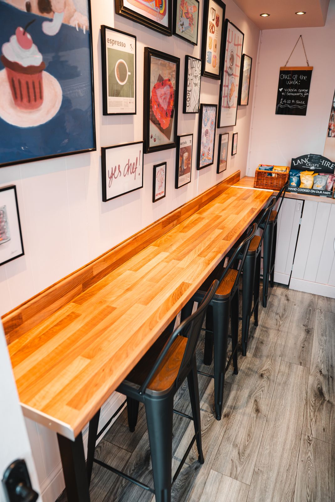 The window bar and stools inside the bakery