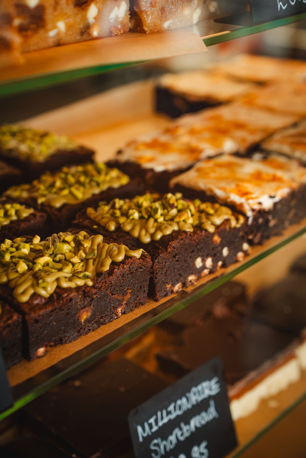 Pistachio topped brownies and traybakes in the counter